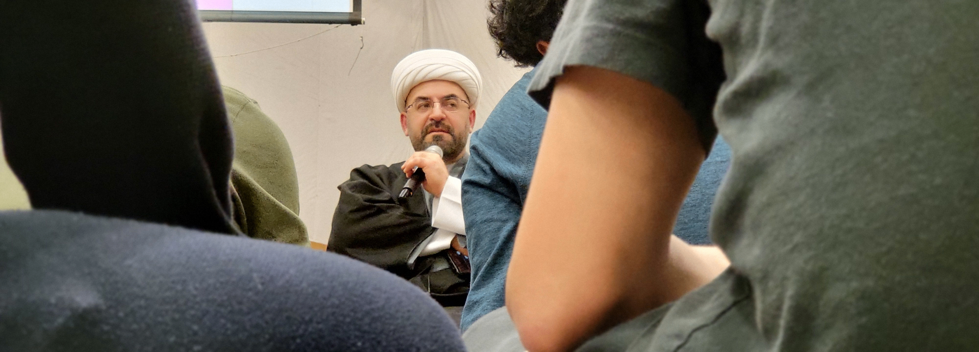 Sh. Aous Asfar speaking to youth at a workshop